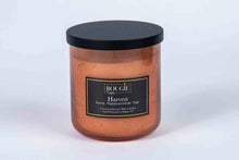 Load image into Gallery viewer, Candle with a black lid and label on a white background