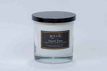 Load image into Gallery viewer, Glass candle with a black lid and label on a white background