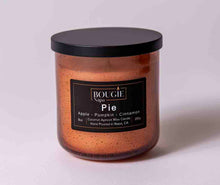 Load image into Gallery viewer, Candle jar with a label on a light gray background