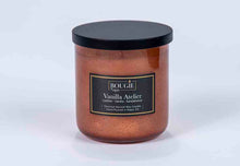 Load image into Gallery viewer, Candle with a black lid and "Vanilla Atelier" label on a white background