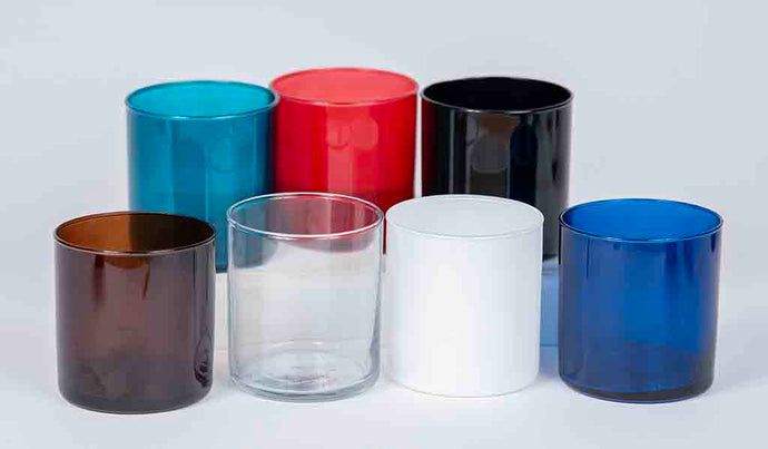 Set of colorful glass tumblers on a white background