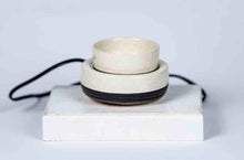 Load image into Gallery viewer, Stack of ceramic candle warming bowls on a white block with a light gray background
