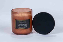 Load image into Gallery viewer, Candle labeled &quot;Vanilla Atelier&quot; with a black lid on a white background
